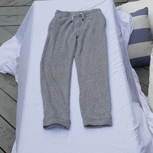 Gray sweatpants with a blue and red drawstring